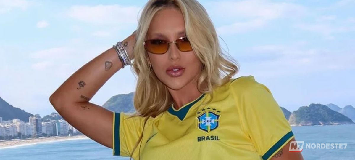 Virginia Fonseca sorrindo em pose profissional, ilustrando a notícia sobre sua estreia na programação da TV Globo.